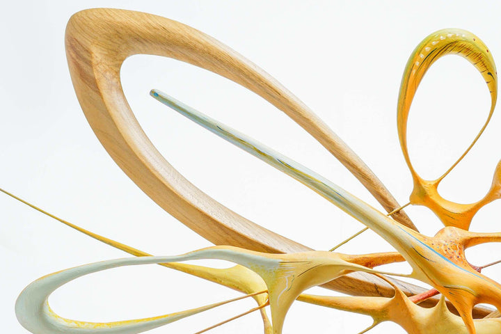 Oil Painting in Sculpture 11.1 by Mark Purllant, a one-off mixed media piece in carved English oak with sculpted oil-painted forms in vivid yellow, orange, and pale blue tones, dynamic and fluid, mounted on a dark base.