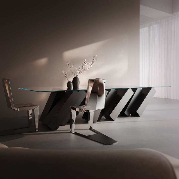 Duffy London Megalith Dining Table with angled black monolithic base and clear glass top, creating a gravity-defying illusion of collapsing architectural forms.