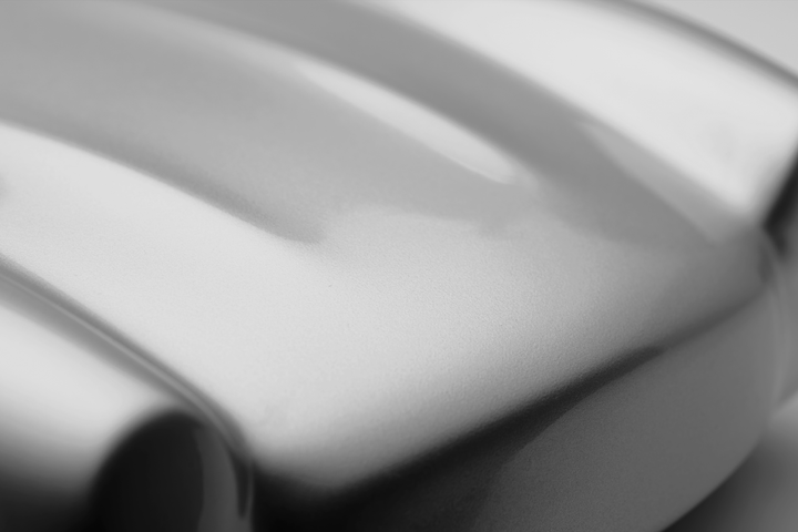 ‘Mercedes 300SL’ by Srini Gandra, a limited-edition contemporary automotive sculpture from the Forme di Velocità series, inspired by the iconic Mercedes-Benz 300 SL Gullwing. Presented in an elegant Silver Grey metallic finish, the sculpture captures the classic sports car's elongated bonnet, distinctive rounded front wings, low-slung body, sculpted side contours and gracefully curved roofline. Its smooth, minimalist surfaces celebrate the aerodynamic elegance, timeless proportions and pioneering design of 