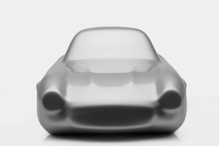 ‘Mercedes 300SL’ by Srini Gandra, a limited-edition contemporary automotive sculpture from the Forme di Velocità series, inspired by the iconic Mercedes-Benz 300 SL Gullwing. Presented in an elegant Silver Grey metallic finish, the sculpture captures the classic sports car's elongated bonnet, distinctive rounded front wings, low-slung body, sculpted side contours and gracefully curved roofline. Its smooth, minimalist surfaces celebrate the aerodynamic elegance, timeless proportions and pioneering design of 