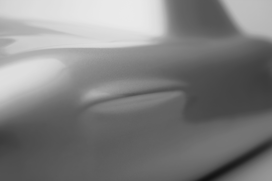 ‘Mercedes 300SL’ by Srini Gandra, a limited-edition contemporary automotive sculpture from the Forme di Velocità series, inspired by the iconic Mercedes-Benz 300 SL Gullwing. Presented in an elegant Silver Grey metallic finish, the sculpture captures the classic sports car's elongated bonnet, distinctive rounded front wings, low-slung body, sculpted side contours and gracefully curved roofline. Its smooth, minimalist surfaces celebrate the aerodynamic elegance, timeless proportions and pioneering design of 