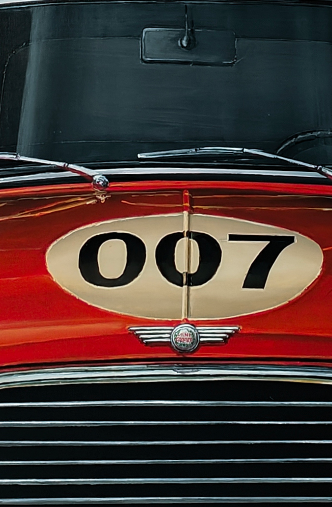 Hyperrealistic painting of a classic red Mini Cooper with cream roof viewed head-on, its grille and chrome bumpers gleaming against a deep black background. The bonnet bears a cream racing roundel with the number “007,” while above it floats a shiny pink mouse-shaped balloon with a black bow tie, tethered by a thin red string. Playful yet satirical, the scene humorously reimagines British motoring culture and spy glamour.