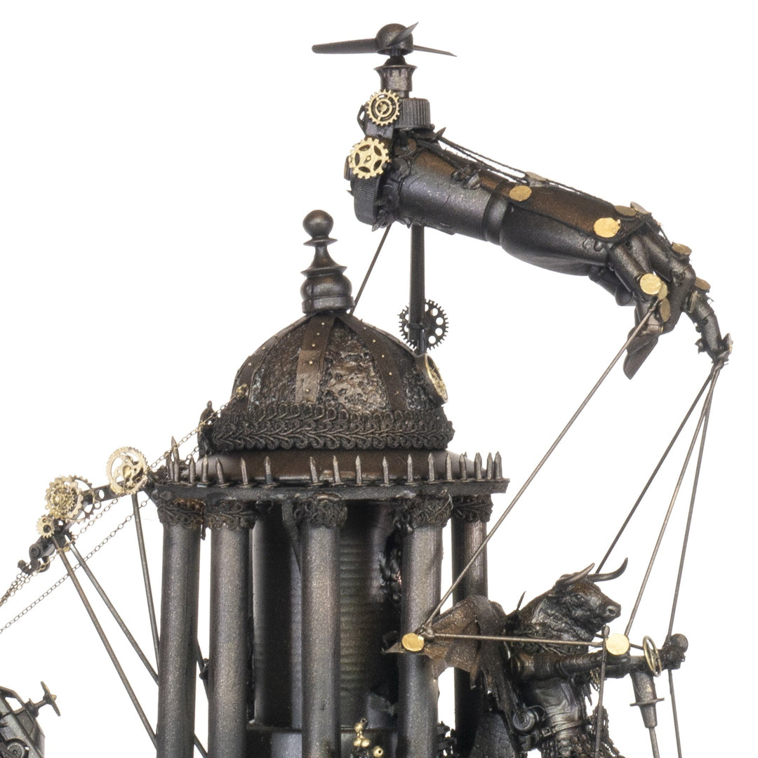 “Minotaurs’ Mobile Home” by Andrew Stevens – a one-off steampunk sculpture crafted from recycled metal, toys and wood. Featuring winged Minotaur figures amid gears and domed structures, finished in dark bronze patina with intricate mechanical detail.