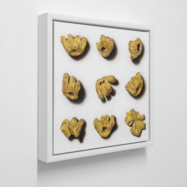 Roast Beef Monster Munch by Simon Taylor – photorealistic oil painting of nine golden, textured crisp snacks arranged in a grid on a white ground, each piece casting soft shadows, celebrating everyday British culture through hyper-detailed wall art.