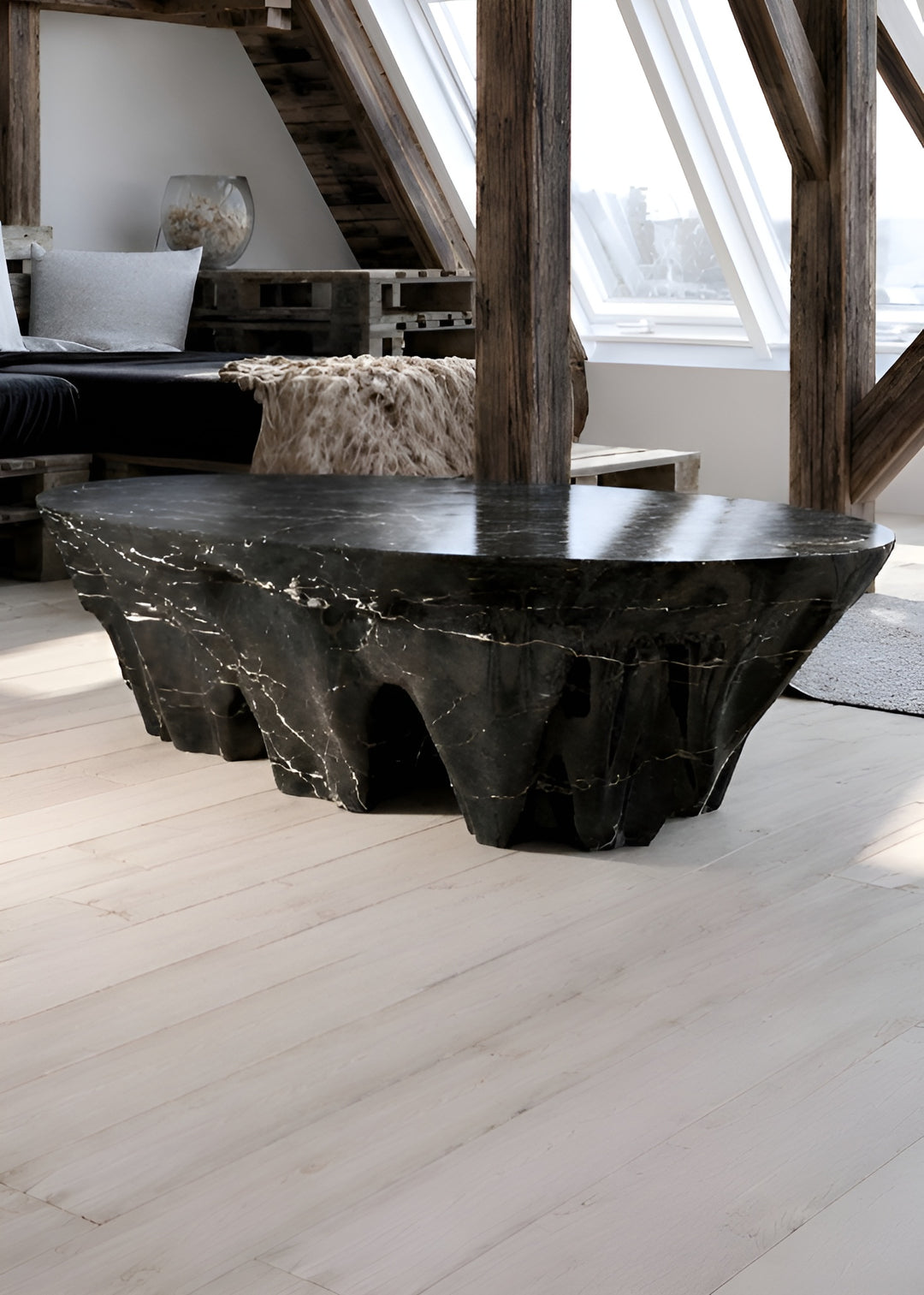 Duffy London Monument Valley Dining Table carved from marble with sculptural canyon-like base and glass top, inspired by natural rock formations.