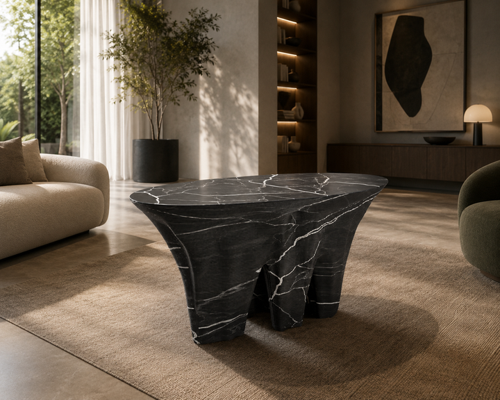Duffy London Monument Valley Dining Table carved from marble with sculptural canyon-like base and glass top, inspired by natural rock formations.