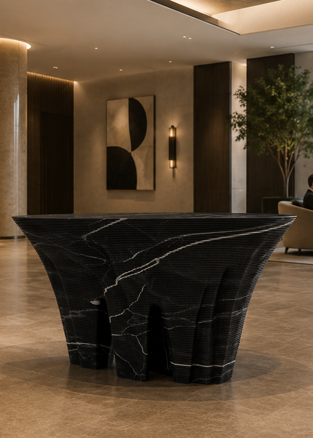 Duffy London Monument Valley Dining Table carved from marble with sculptural canyon-like base and glass top, inspired by natural rock formations.