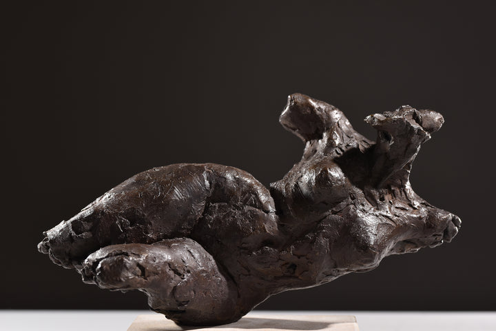 ‘Nude Emergence Torso’ by Hamish Mackie, a limited-edition contemporary bronze figurative sculpture depicting a fragmented reclining female nude torso. Inspired by ancient sculptural artefacts, the abstracted human form features rough, expressive modelling, weathered surfaces and an earthy brown bronze patina. Mounted horizontally on a rectangular Ancaster Weatherbed stone plinth, the sculpture explores the natural beauty and tactile qualities of the female form.