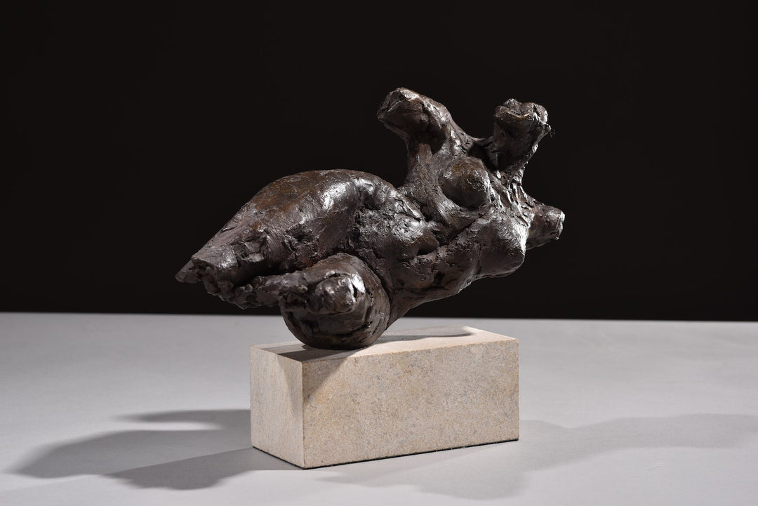 ‘Nude Emergence Torso’ by Hamish Mackie, a limited-edition contemporary bronze figurative sculpture depicting a fragmented reclining female nude torso. Inspired by ancient sculptural artefacts, the abstracted human form features rough, expressive modelling, weathered surfaces and an earthy brown bronze patina. Mounted horizontally on a rectangular Ancaster Weatherbed stone plinth, the sculpture explores the natural beauty and tactile qualities of the female form.