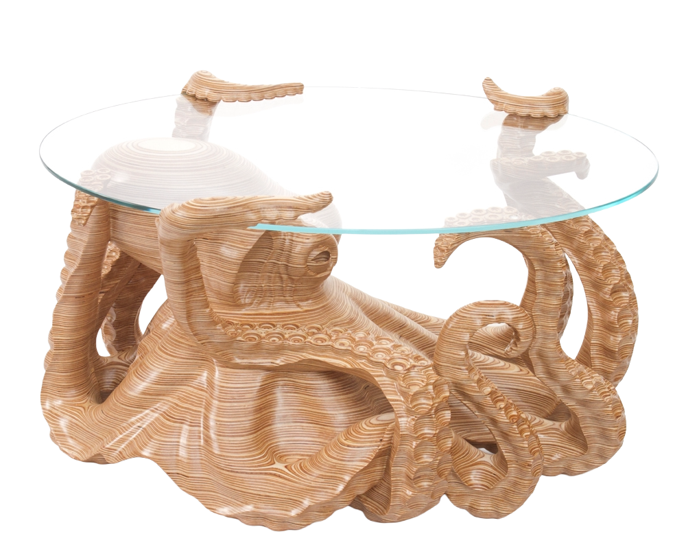 Hand-carved birch plywood octopus coffee table by Bill Prickett with sculptural tentacles supporting a low iron toughened glass top, combining functional furniture with detailed contemporary wood sculpture.