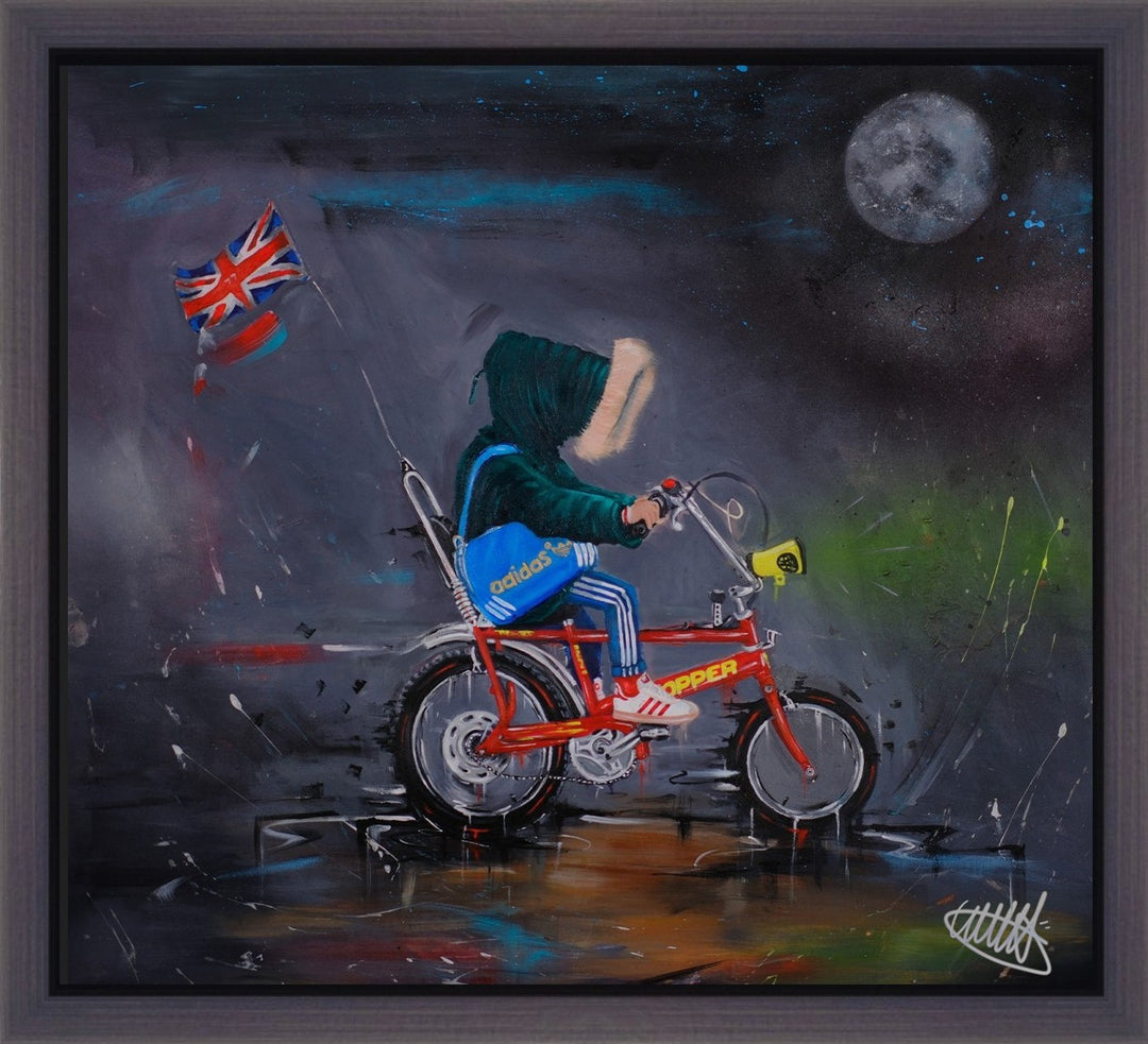 Limited edition framed hand finished canvas print of the original painting “Chopper 77 Graffiti” by Wild Seeley — gritty nostalgic British street scene with a hooded rider on a bright red Raleigh Chopper bike at night, Union Jack flag flying behind, Adidas blue bag, Adidas trainers, moody grey-black sky with a glowing moon and splashes of spray-paint energy.