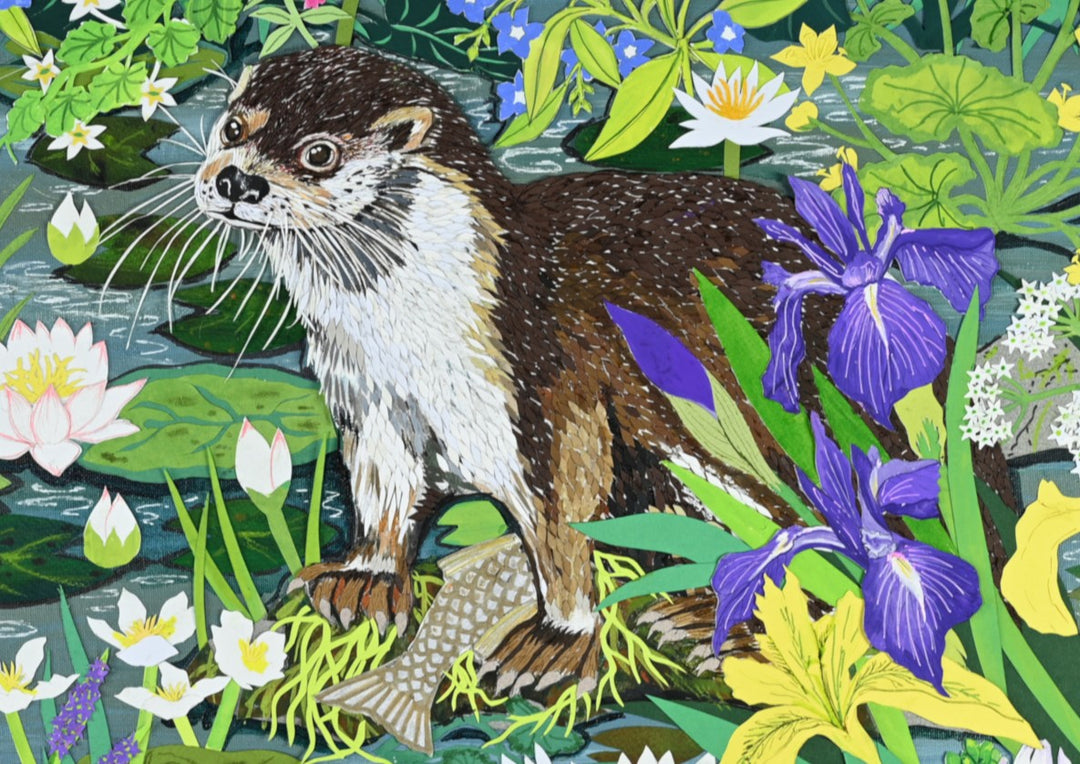 Cut-paper artwork featuring two otters among dense water-garden foliage, holding fish beside irises, waterlilies and wildflowers, with layered greens, blues and yellows creating a vibrant, nature-rich scene.