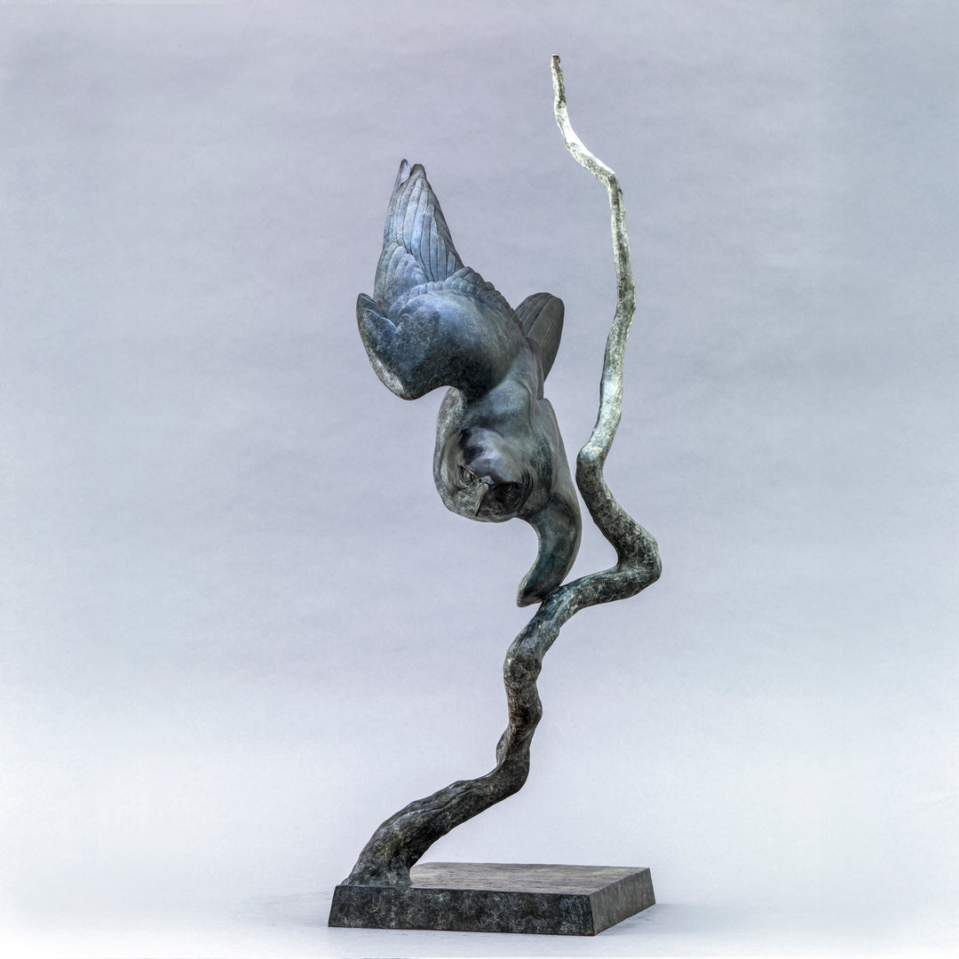 Nick Bibby bronze sculpture of a life-size peregrine falcon captured in a dramatic diving stoop, its swept wings and slate-grey patina emphasising speed, precision and sculptural elegance in a striking, aerodynamic form.