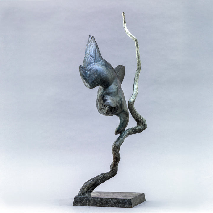Nick Bibby bronze sculpture of a life-size peregrine falcon captured in a dramatic diving stoop, its swept wings and slate-grey patina emphasising speed, precision and sculptural elegance in a striking, aerodynamic form.