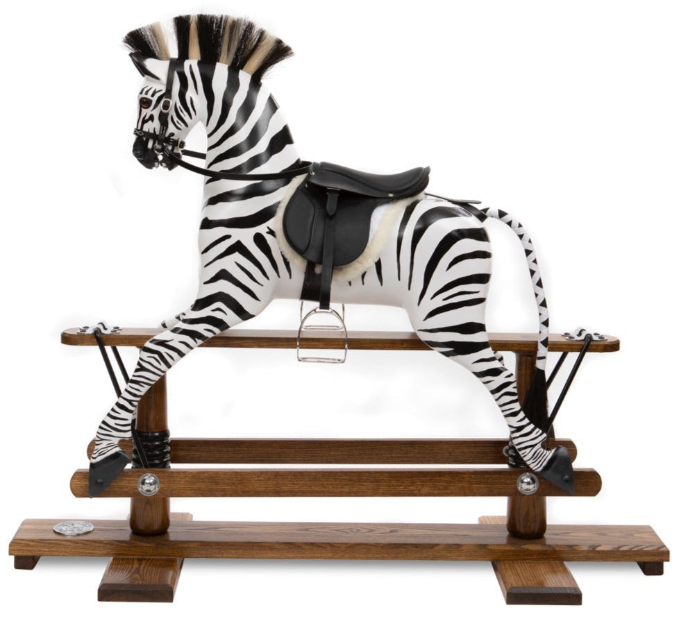 Hand-painted wooden rocking zebra with black leather saddle, mounted on a dark oak safety stand.

