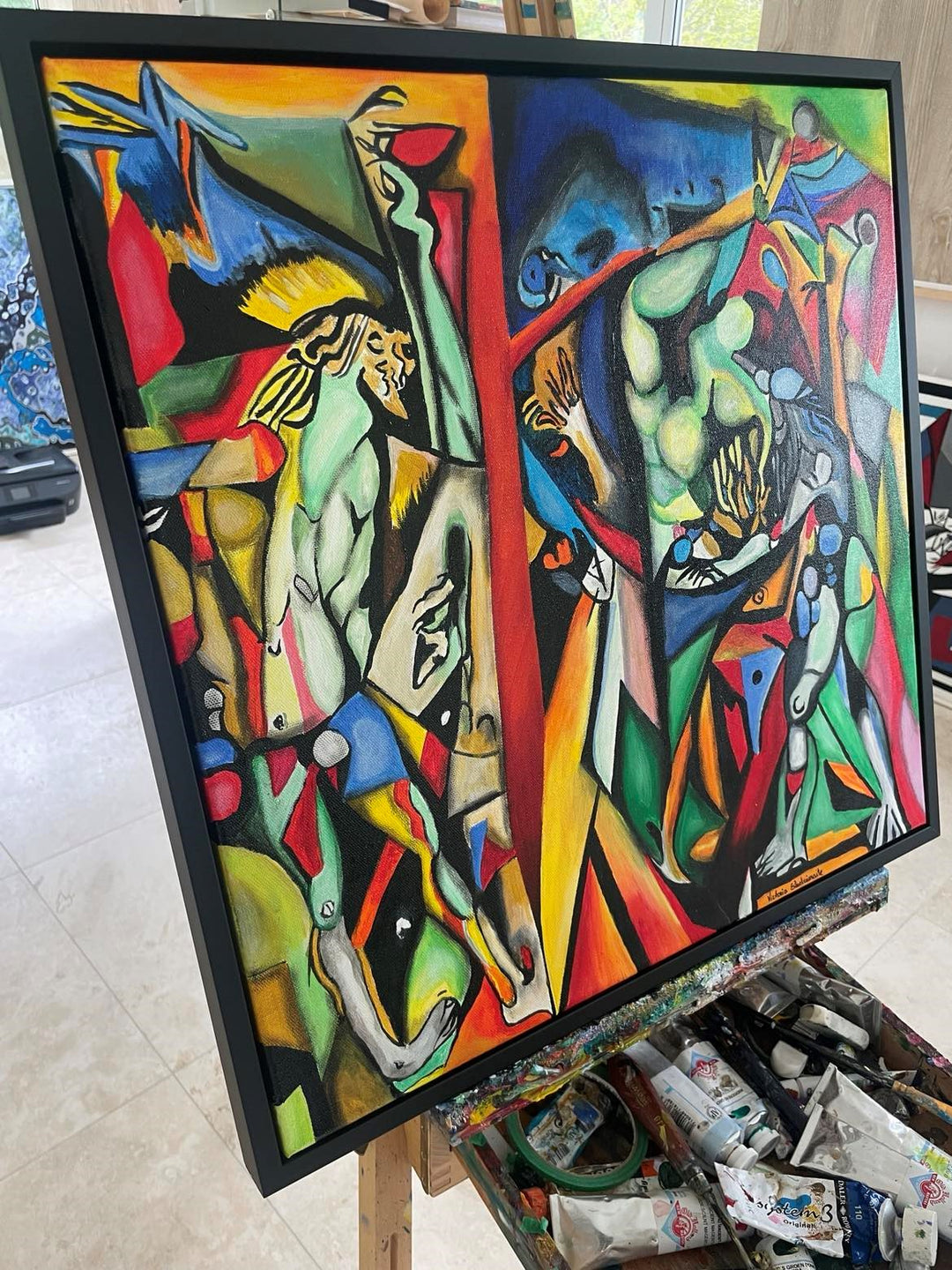 Vibrant abstract painting with intertwined human figures, bold colours, and fragmented geometric shapes in a surreal composition.