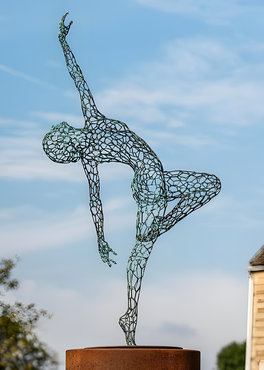 ‘Parallel Passé’ by Simon Gudgeon, a limited-edition figurative bronze sculpture inspired by Prima Ballerina Ksenia Ovsyanick. The life-size female dancer is captured en pointe in an elegant, dynamic ballet pose, formed through an intricate open Voronoi lattice that allows light and the surrounding environment to pass through and transform the sculpture.