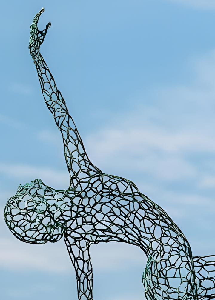 ‘Parallel Passé’ by Simon Gudgeon, a limited-edition figurative bronze sculpture inspired by Prima Ballerina Ksenia Ovsyanick. The life-size female dancer is captured en pointe in an elegant, dynamic ballet pose, formed through an intricate open Voronoi lattice that allows light and the surrounding environment to pass through and transform the sculpture.