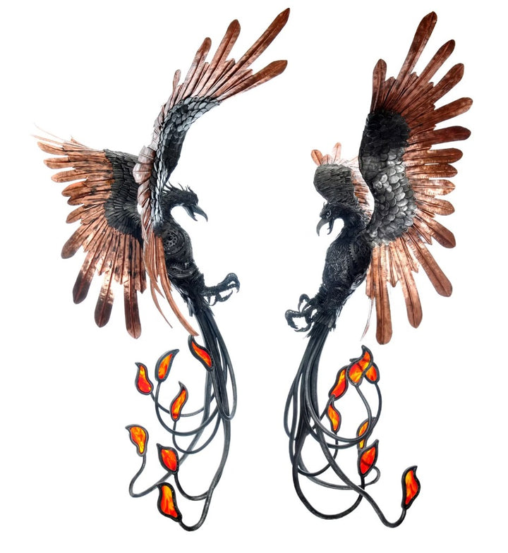 Winged steampunk Phoenix sculpture crafted from reclaimed metal with mechanical detailing and flowing tentacle-like elements.