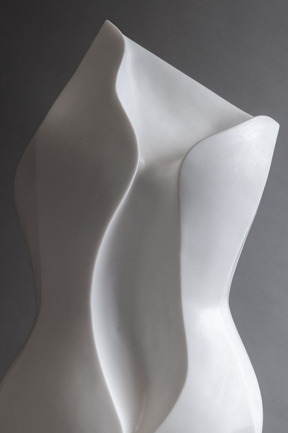 Lucy Unwin marble sculpture Primavera, hand carved from white Statuary Carrara marble, featuring an elegant contemporary abstract form inspired by the curves of the female body and organic forms found in nature.