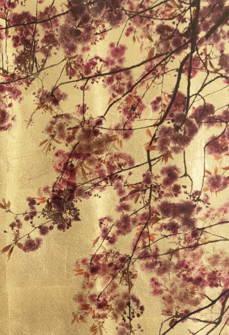 Robert Pereira Hind’s Prunus from the Out of Eden series — a delicate mixed media portrayal of cherry blossom branches in full bloom, encircling a single swallow in flight. Pink and magenta petals contrast against a luminous gold-leaf background, with subtle autumnal leaves adding warmth. Created using acrylic paint and organic photographic pigment on a gilded wooden panel, the surface is finished with shellac and art glazes to develop a rich, natural patina over time.
