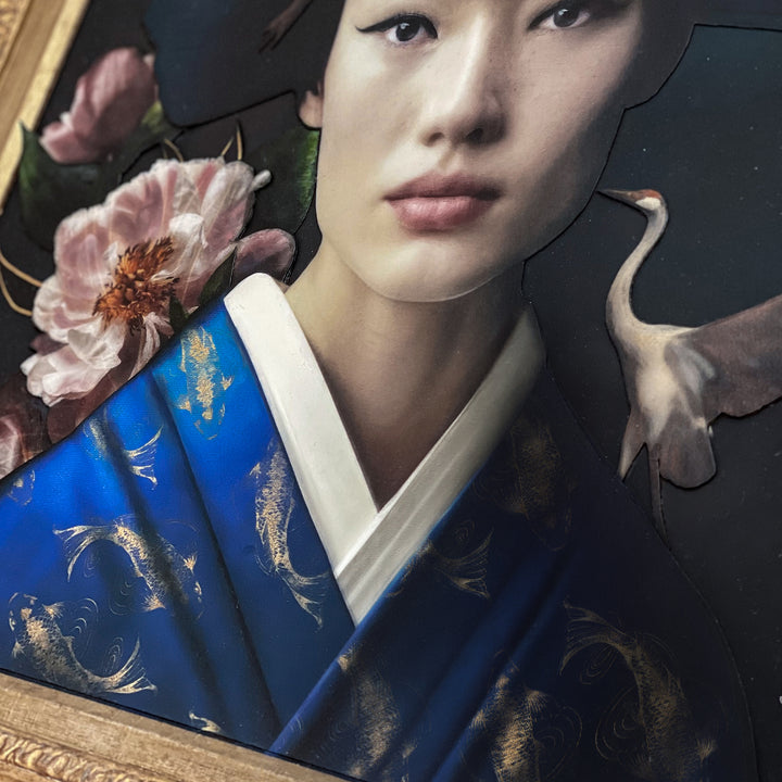 Catarina Diaz’s Quintessence, analogue collage on Somerset Enhanced Velvet with oil on canvas board. Portrait of an East Asian woman in a cobalt blue kimono with gold koi, framed by peonies, flying cranes, and a soft clouded backdrop in an ornate antique gold frame.