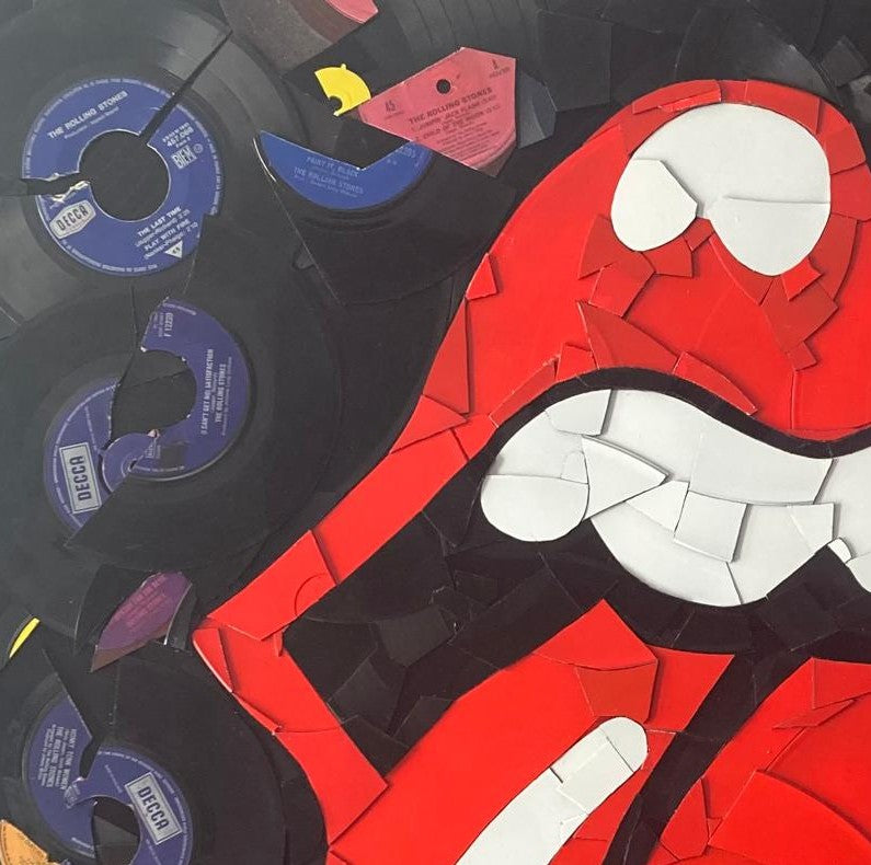 Ed Chapman mosaic of the Rolling Stones’ iconic tongue and lips logo, meticulously crafted from broken original Rolling Stones vinyl records in striking red, black, and white tones.