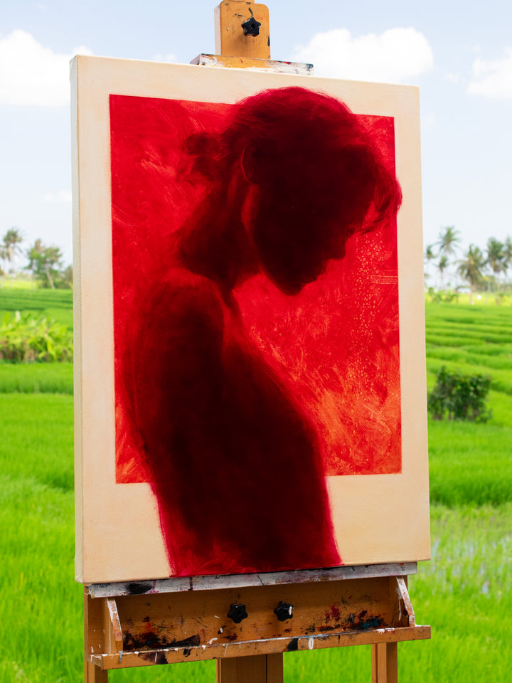 Oil on canvas painting by Dan Bullock, titled Radiance. A striking silhouette portrait of a woman in profile, painted entirely in deep crimson red within a bold rectangular frame, set against a neutral canvas ground. The figure’s bowed head and soft edges evoke intimacy and contemplation, with rich tonal depth and glowing intensity.