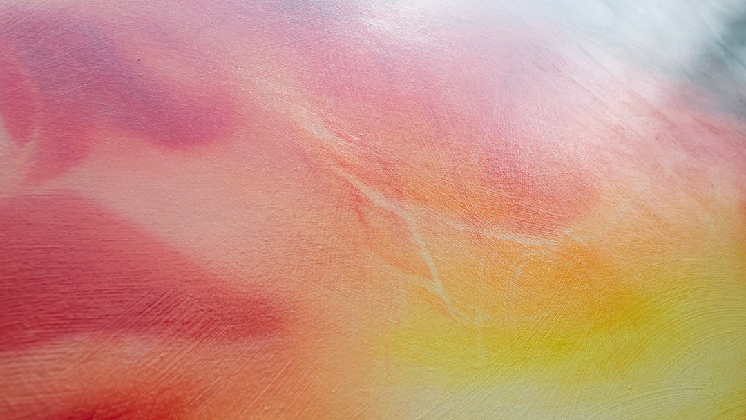Large oil on canvas painting by Dan Bullock, titled Reverie. A dreamlike portrait of a female face in profile, dissolving into swirling colours of fiery red, orange, and golden yellow, contrasted with cool blue and smoky black tones. The composition radiates energy and motion, blending realism with abstraction.