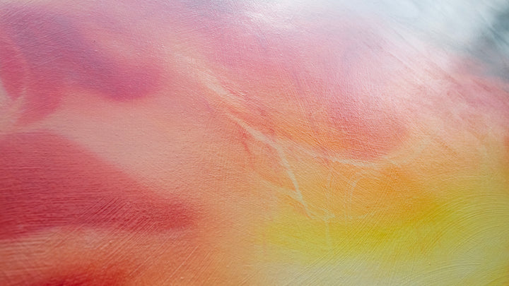 Large oil on canvas painting by Dan Bullock, titled Reverie. A dreamlike portrait of a female face in profile, dissolving into swirling colours of fiery red, orange, and golden yellow, contrasted with cool blue and smoky black tones. The composition radiates energy and motion, blending realism with abstraction.