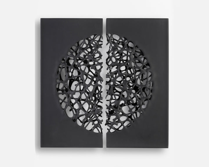 Tracy Nicholls glass wall sculpture Riven — a one-off artwork of two black glass panels forming an orb when placed side by side. The intricate webbed structure undulates with organic movement, featuring a satin-smooth exterior contrasting with a glossy black inner surface that glimmers through the open lace-like forms.