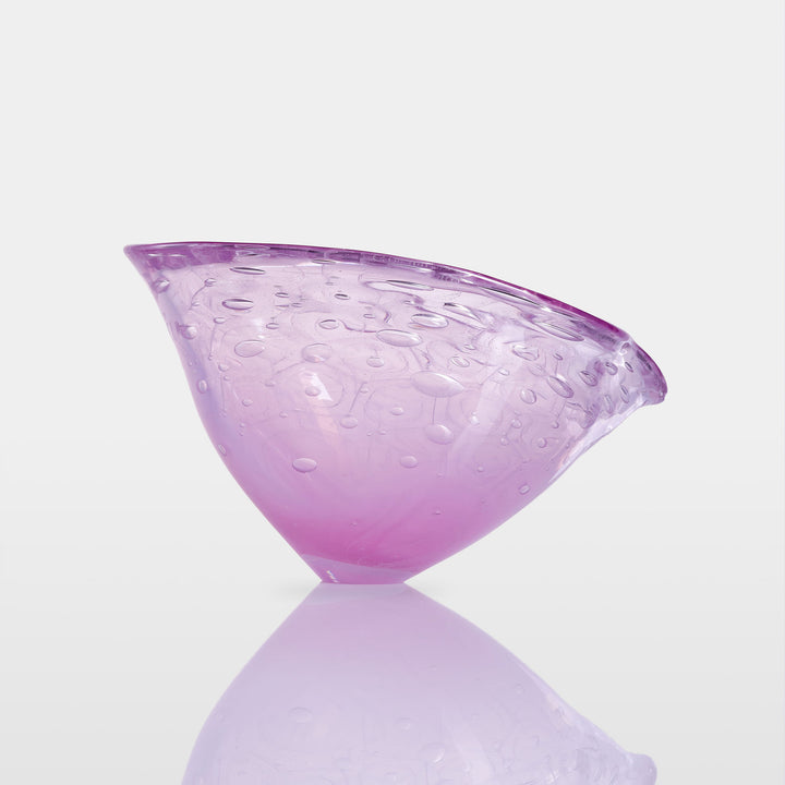 Delicately shaped lilac glass vessel with an organic rim and embossed bubble-like texture, set against a white background with soft reflection.