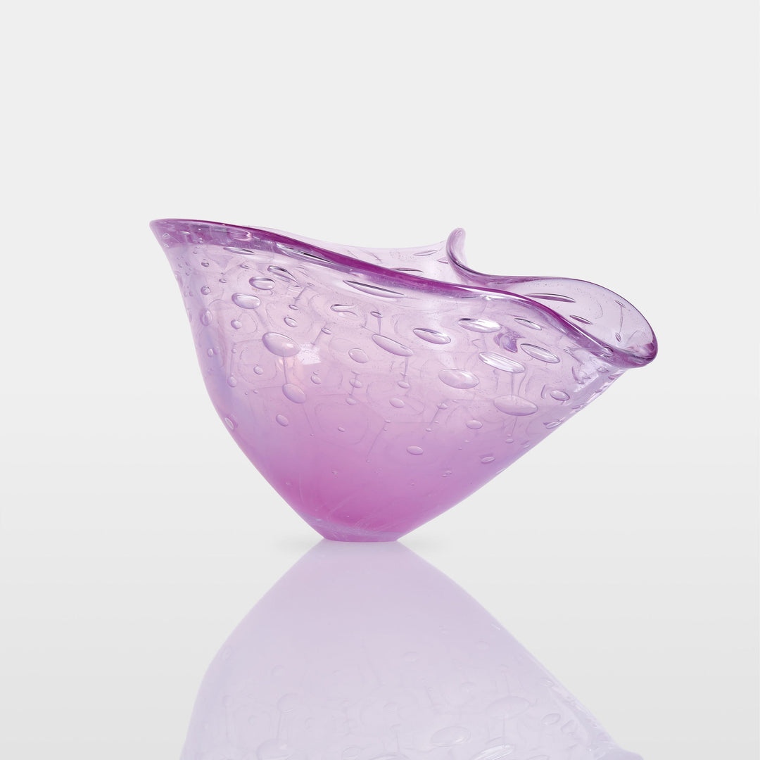 Delicately shaped lilac glass vessel with an organic rim and embossed bubble-like texture, set against a white background with soft reflection.