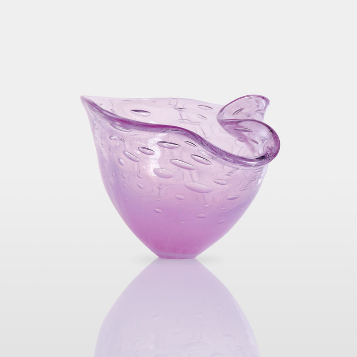 Delicately shaped lilac glass vessel with an organic rim and embossed bubble-like texture, set against a white background with soft reflection.