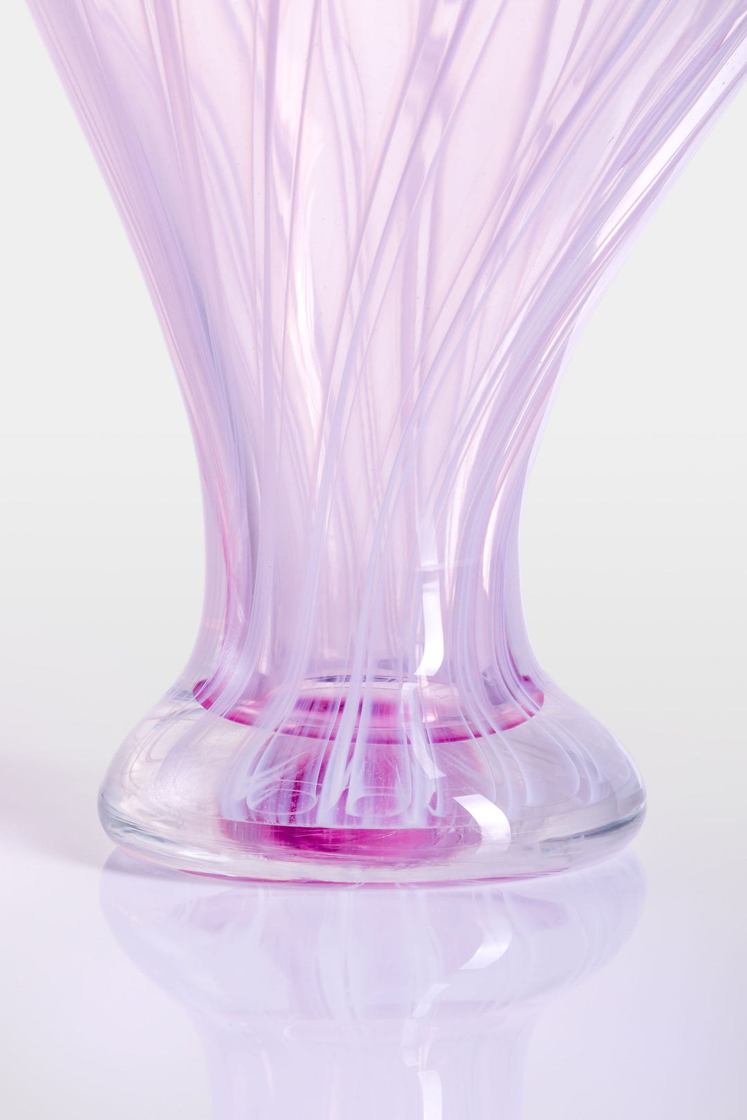 Elegant hand-blown glass sculpture with a balloon-like silhouette and gently tapered base, featuring soft lavender and pink tones with delicate swirling lines throughout.