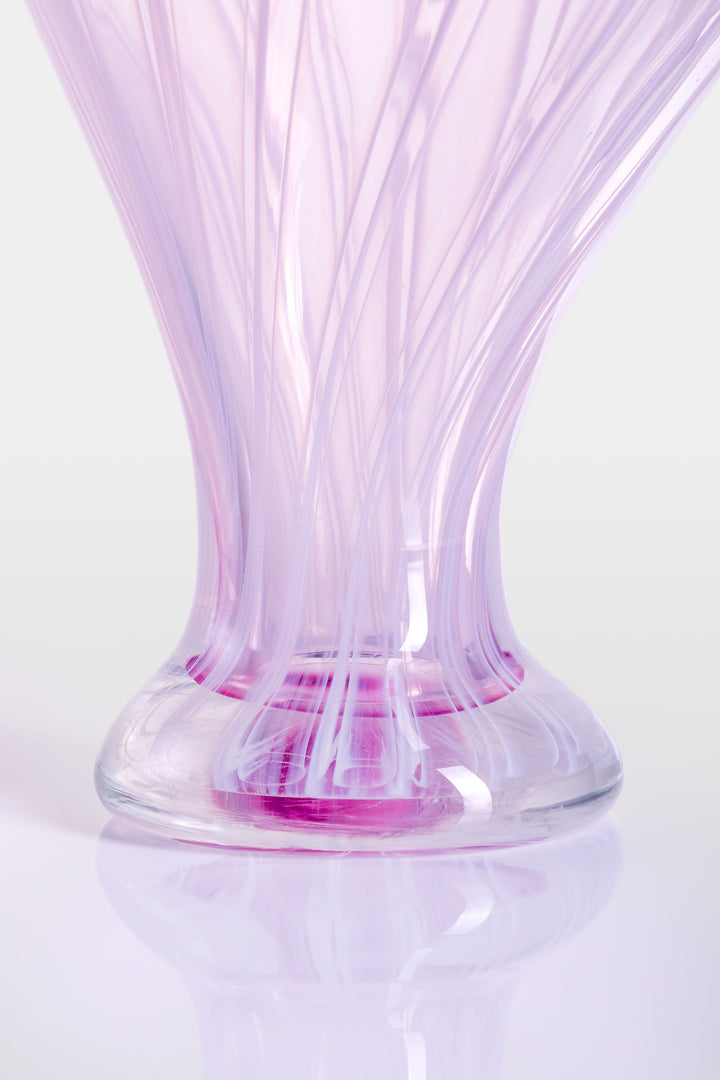 Elegant hand-blown glass sculpture with a balloon-like silhouette and gently tapered base, featuring soft lavender and pink tones with delicate swirling lines throughout.