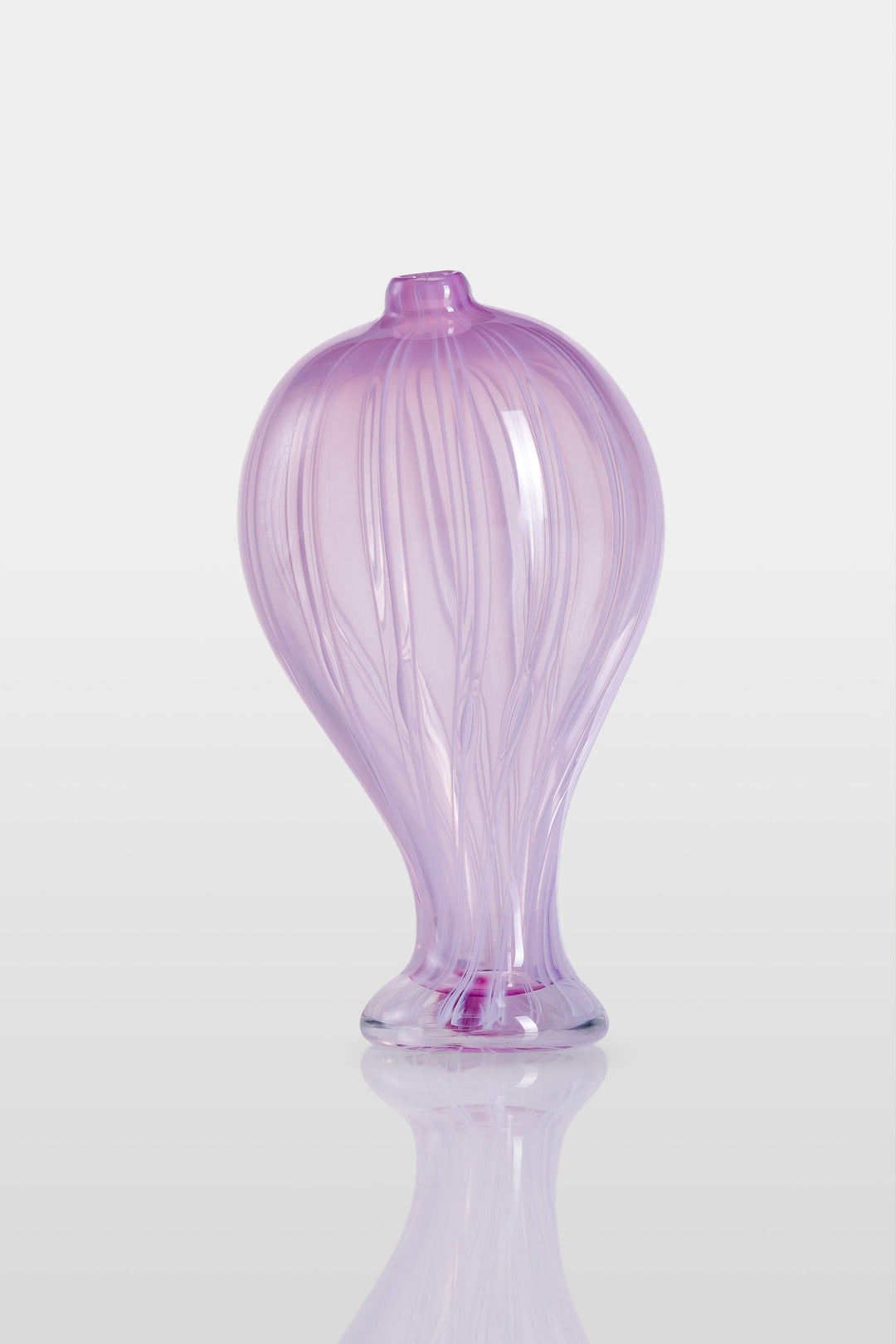Elegant hand-blown glass sculpture with a balloon-like silhouette and gently tapered base, featuring soft lavender and pink tones with delicate swirling lines throughout.