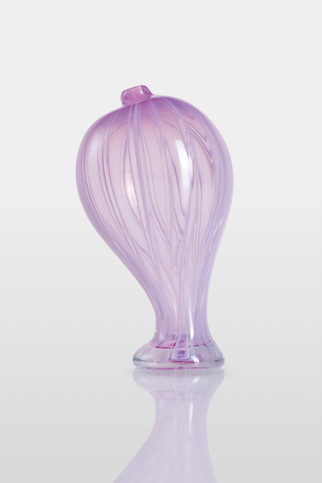 Elegant hand-blown glass sculpture with a balloon-like silhouette and gently tapered base, featuring soft lavender and pink tones with delicate swirling lines throughout.
