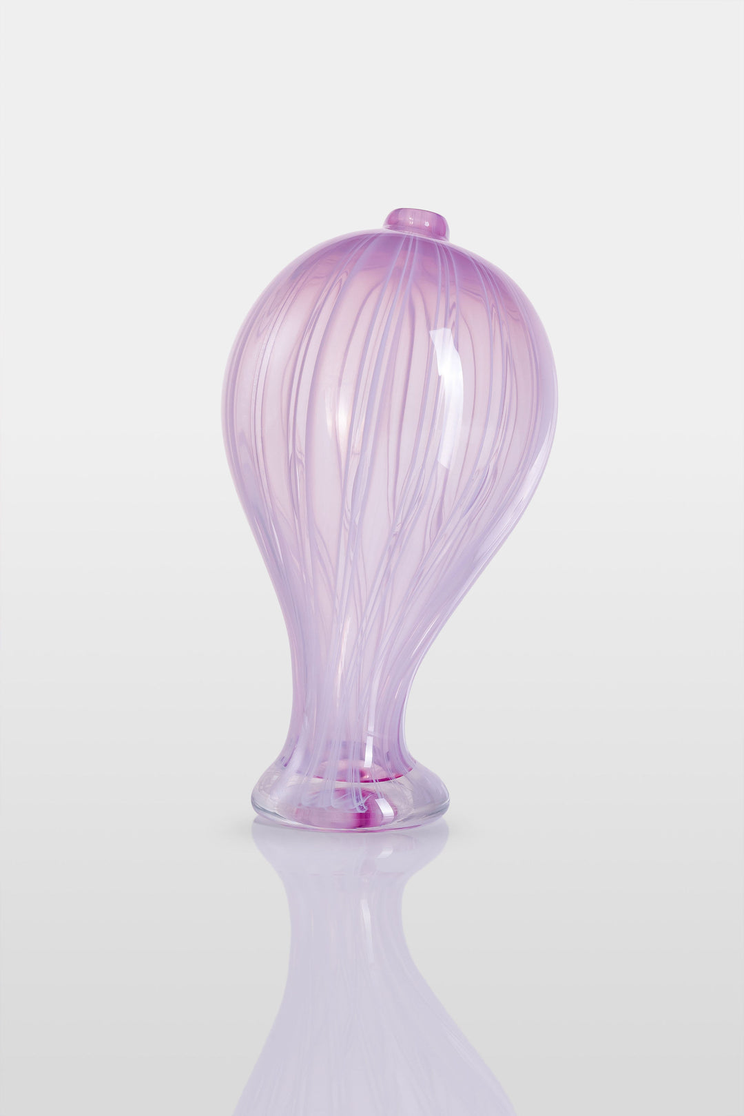 Elegant hand-blown glass sculpture with a balloon-like silhouette and gently tapered base, featuring soft lavender and pink tones with delicate swirling lines throughout.