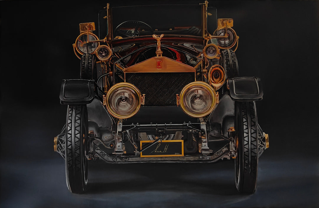 Hyperrealistic painting of a vintage Rolls-Royce viewed head-on, bathed in dramatic golden highlights against a deep black background. The iconic Spirit of Ecstasy hood ornament crowns the polished brass grille, flanked by ornate circular headlights and intricate mechanical details. The symmetrical, imposing composition transforms the car into a symbol of luxury, heritage, and cultural grandeur.