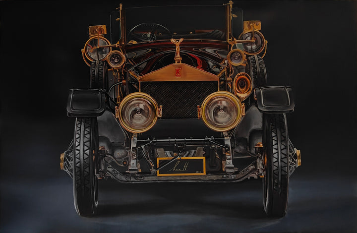 Hyperrealistic painting of a vintage Rolls-Royce viewed head-on, bathed in dramatic golden highlights against a deep black background. The iconic Spirit of Ecstasy hood ornament crowns the polished brass grille, flanked by ornate circular headlights and intricate mechanical details. The symmetrical, imposing composition transforms the car into a symbol of luxury, heritage, and cultural grandeur.