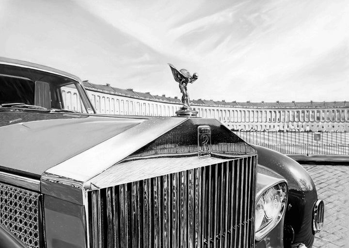 Monochrome pastel artwork depicting the front grille and bonnet of a Rolls-Royce with the Spirit of Ecstasy ornament in sharp focus, positioned against the sweeping curve of Bath’s Royal Crescent, with polished chrome, sculpted metal and architectural stonework rendered through subtle tonal shifts, light and shadow.