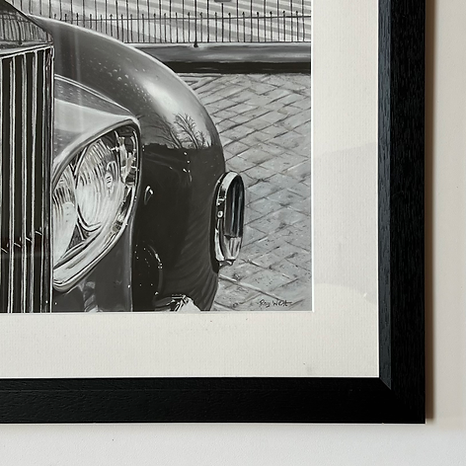 Monochrome pastel artwork depicting the front grille and bonnet of a Rolls-Royce with the Spirit of Ecstasy ornament in sharp focus, positioned against the sweeping curve of Bath’s Royal Crescent, with polished chrome, sculpted metal and architectural stonework rendered through subtle tonal shifts, light and shadow.