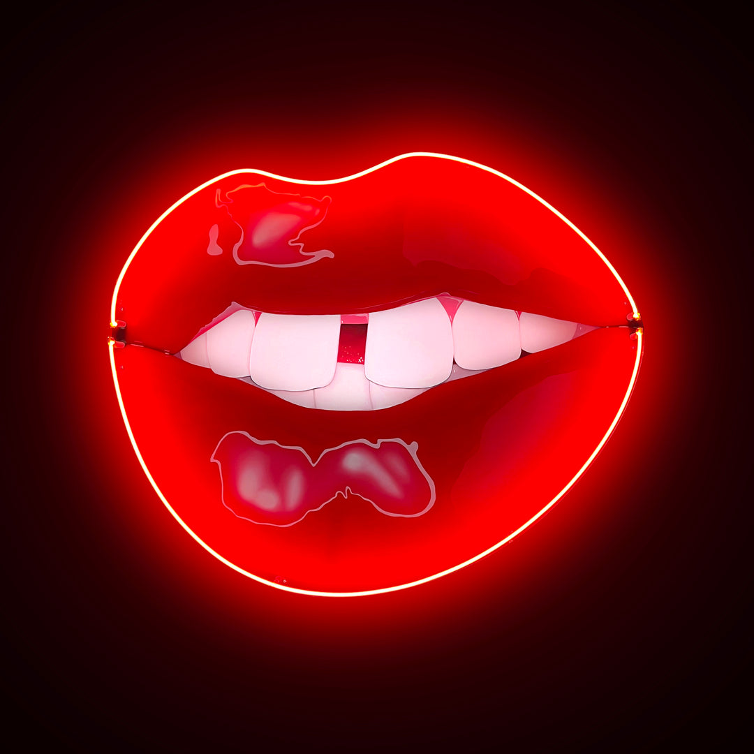 Bright red neon lips with white teeth, set against a dark background.
