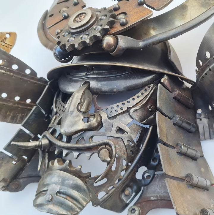 Samurai-inspired helmet sculpture crafted from reclaimed metal with intricate steampunk detailing.