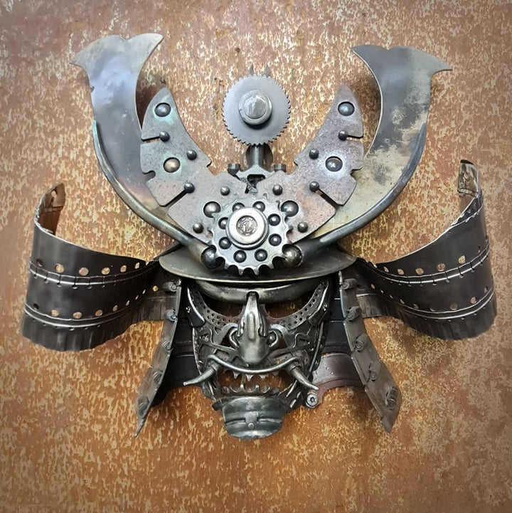 Samurai-inspired helmet sculpture crafted from reclaimed metal with intricate steampunk detailing.