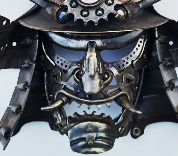 Samurai-inspired helmet sculpture crafted from reclaimed metal with intricate steampunk detailing.