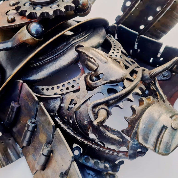 Samurai-inspired helmet sculpture crafted from reclaimed metal with intricate steampunk detailing.