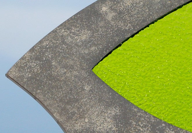Stacey Beaumont Sanctuary slate and glass sculpture, abstract form in reclaimed Delabole slate with lime green textured glass symbolising renewal and vitality.