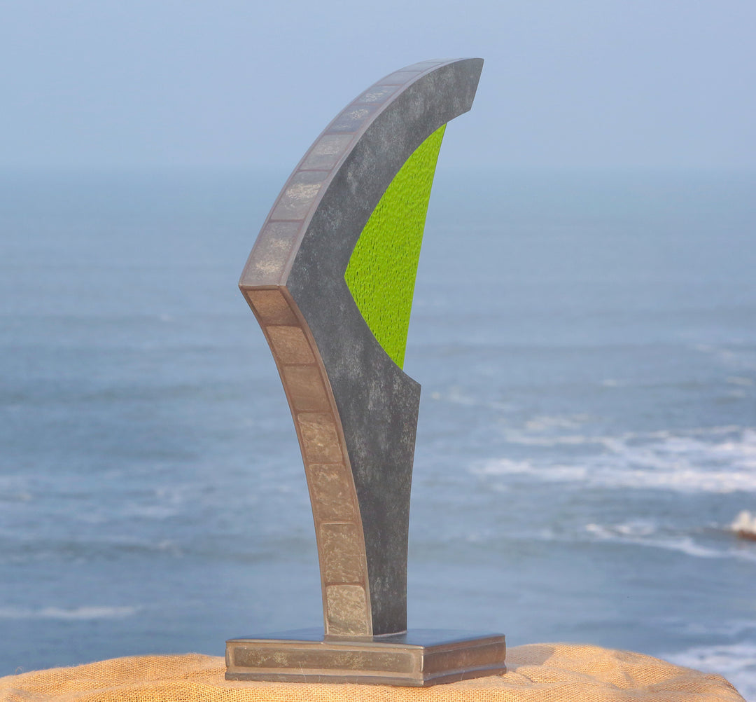 Stacey Beaumont Sanctuary slate and glass sculpture, abstract form in reclaimed Delabole slate with lime green textured glass symbolising renewal and vitality.